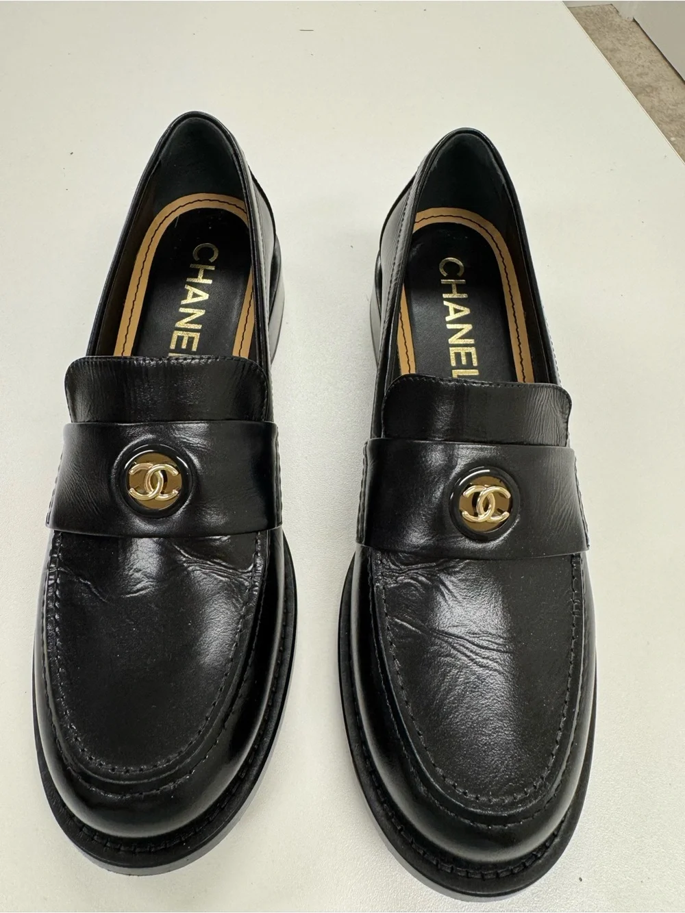 CHANEL Black Leather Loafers with Gold CC Medallions